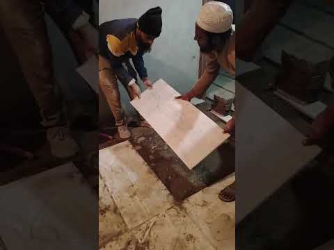 Tile Mason from India Ready for Deployment Large Format Floor Tile Installation