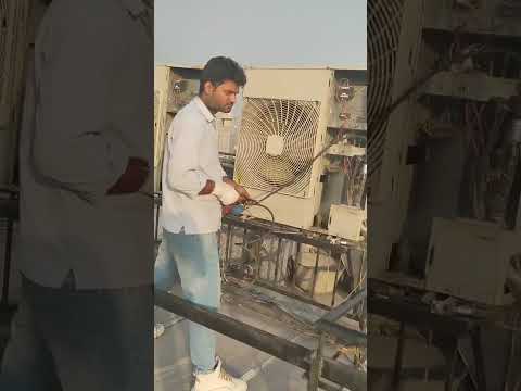 HVAC Technician from India Ready for Deployment AC Condenser Unit Jet Cleaning